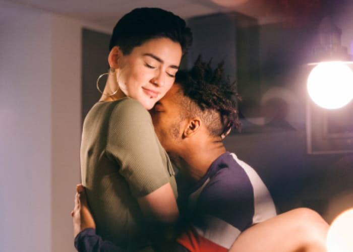 young interracial lovers sharing an intimate moment at home young people
