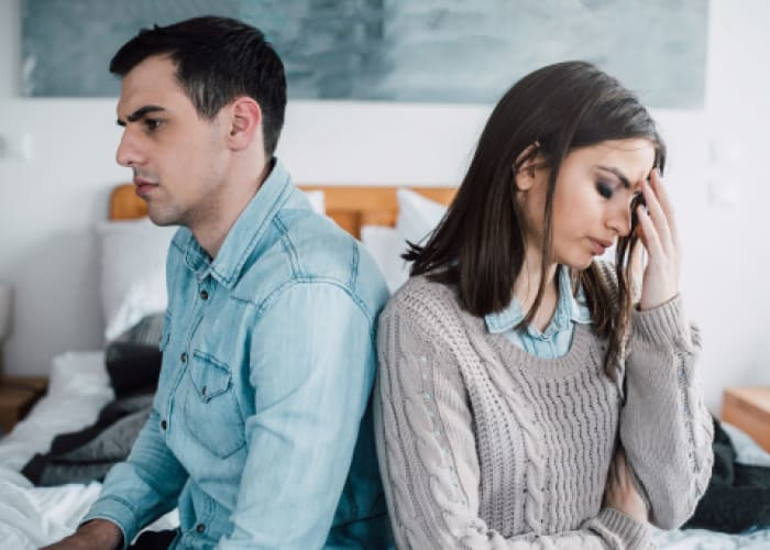 young couple arguing in the bedroom