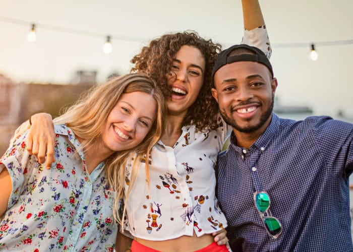 portrait of polyamorous friends celebrating Threesome Day