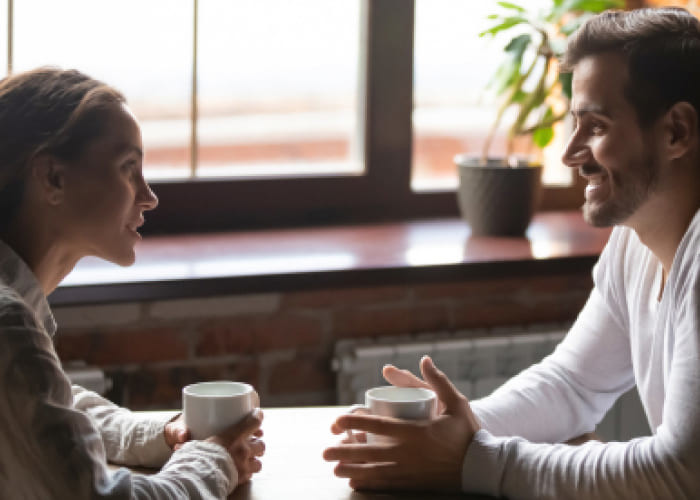 couple sitting in cafe talking and initiating sexual talks