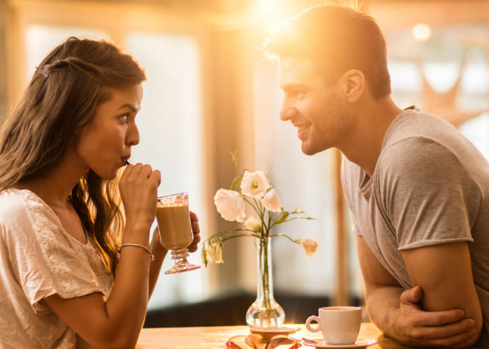 young couple in love spending time together in a café