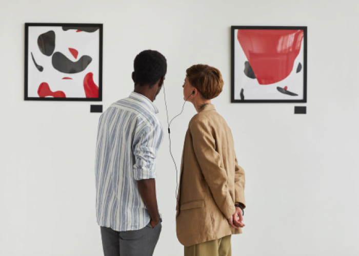 couple looking at modern art in museum