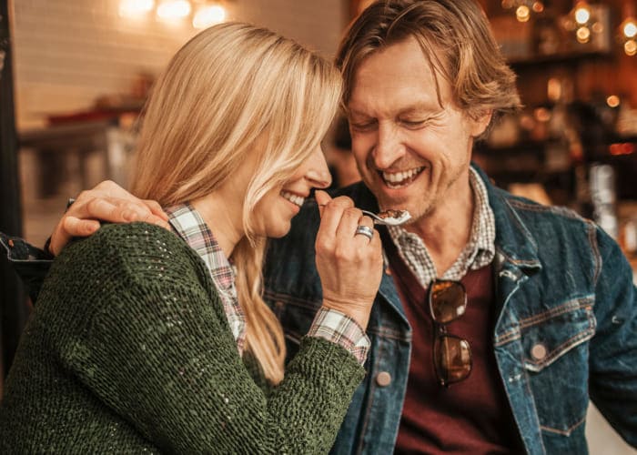 happy mature couple in café