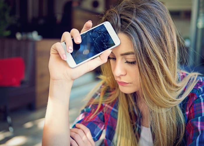 girl with broken mobile phone