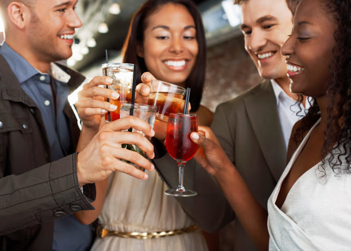 friends toasting at new york bar