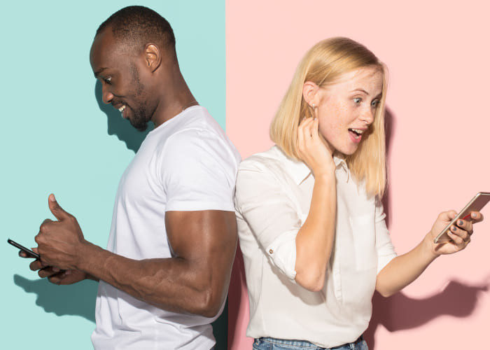 mixed raced couple taking mobile phones