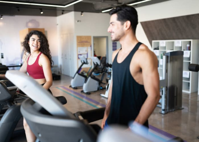 couple flirting in a gym