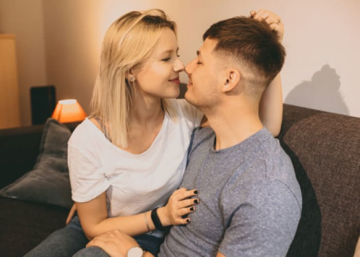 couple sitting together on a sofa