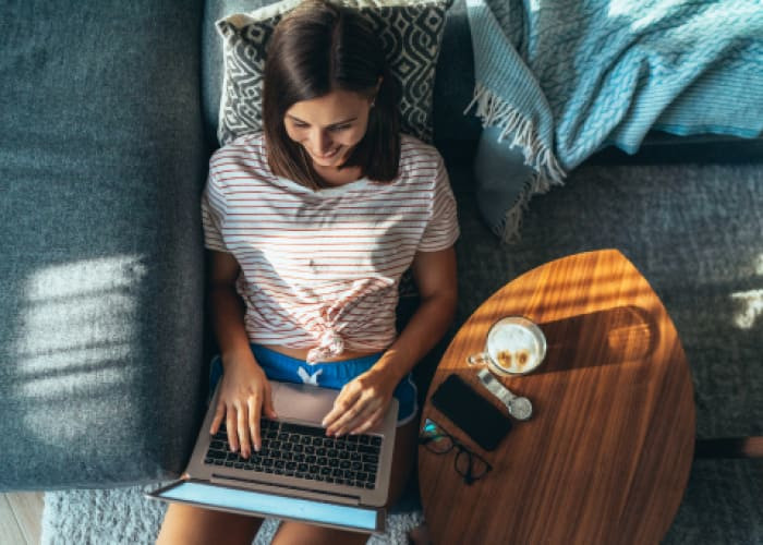 lady relaxing at home with a laptop