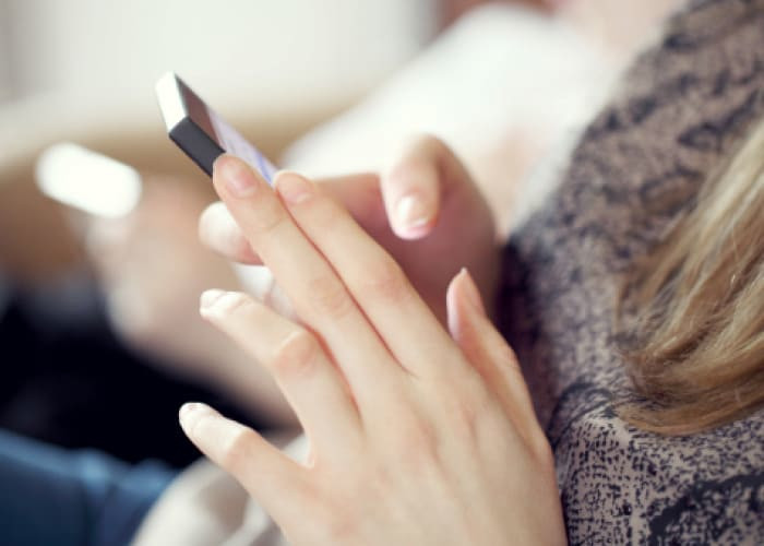 female using her phone