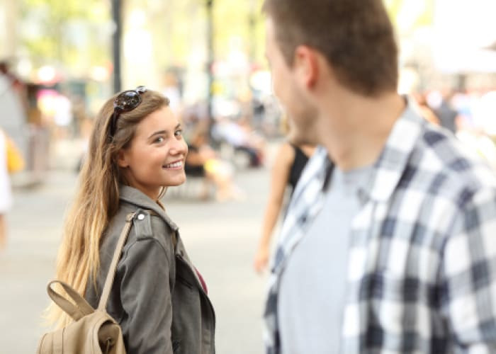 lady and guy flirting on the street