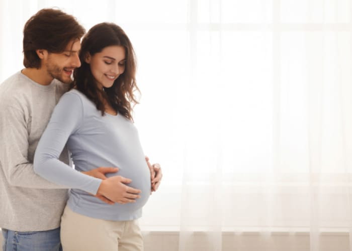 happy expecting couple enjoys life