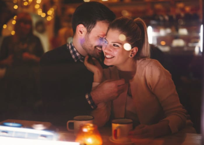 couple dating at night in pub