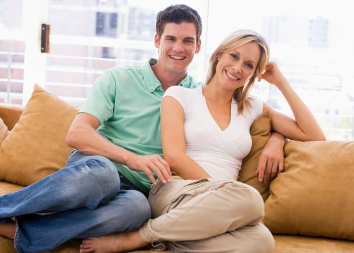 sugar mama and her baby in living room smiling