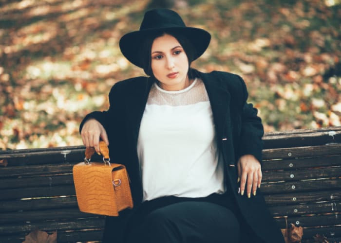 beautiful woman enjoys autumn