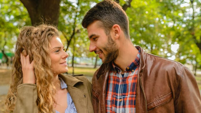 man and woman on date in park