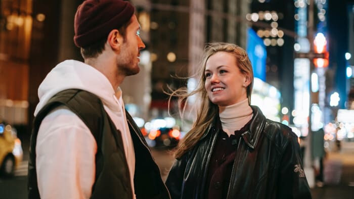 romantic couple standing on street